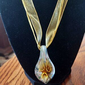 Glass pendant on a ribbon necklace